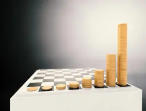 A chess board with stacks of coins on it.