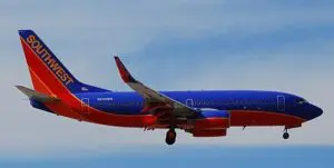 A southwest airlines airplane flying in the sky.