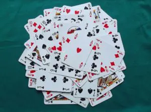 A pile of playing cards on top of each other.