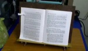 A book is opened on the table to read.