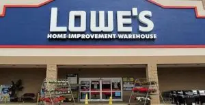 A lowe 's store front with the sign lit up.