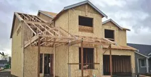 A house under construction with wood framing.
