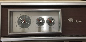 A clock with three different time zones on it.