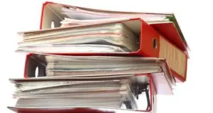 A stack of magazines in red boxes.