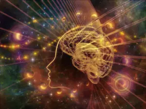 A person 's head with the image of a brain in front.