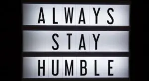 A sign that says always stay humble