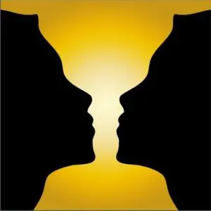 Two people facing each other with a yellow background