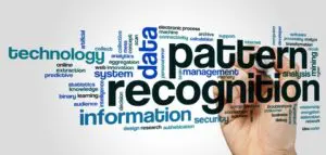 A person writing on the wall with words.