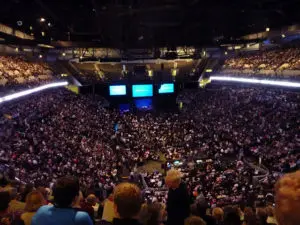 A large crowd of people in an arena.