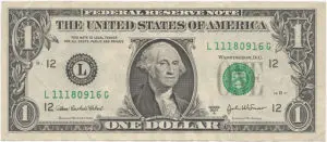 A close up of the front side of a one dollar bill