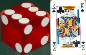 A red dice and the king of clubs card