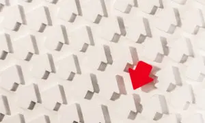 A red arrow is in the middle of many white cubes.