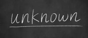 A chalkboard with the word " unknown " written in white chalk.