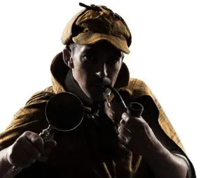 A man holding two pipes in his hands.