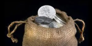 A bag of silver coins and some gold