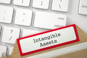 A red and white file folder labeled intangible assets
