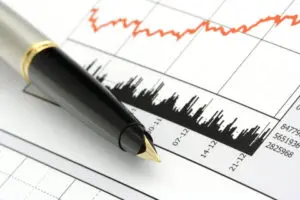 A pen sitting on top of a paper.