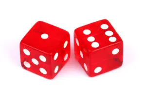 Two red dice with white dots on each side.