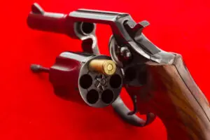 A gun that has been fired with the bullet in it.