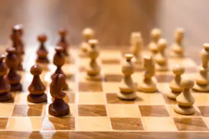 A close up of some chess pieces on a board