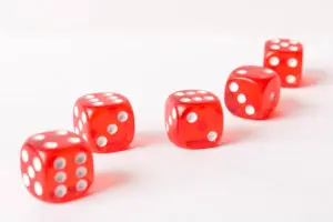 A row of red dice on top of a table.