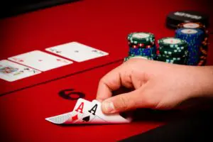 A person is playing cards on the table