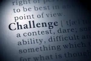 A close up of the word challenge in a dictionary