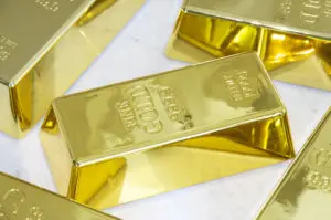 A gold bar sitting on top of some other bars.