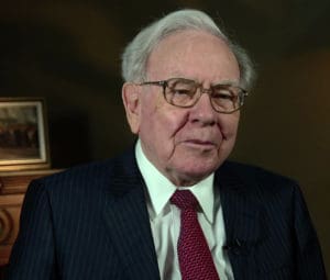 A close up of warren buffett wearing glasses