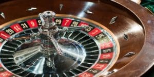 A close up of the wheel on a roulette table