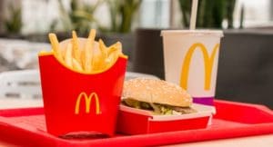 A close up of a hamburger and fries